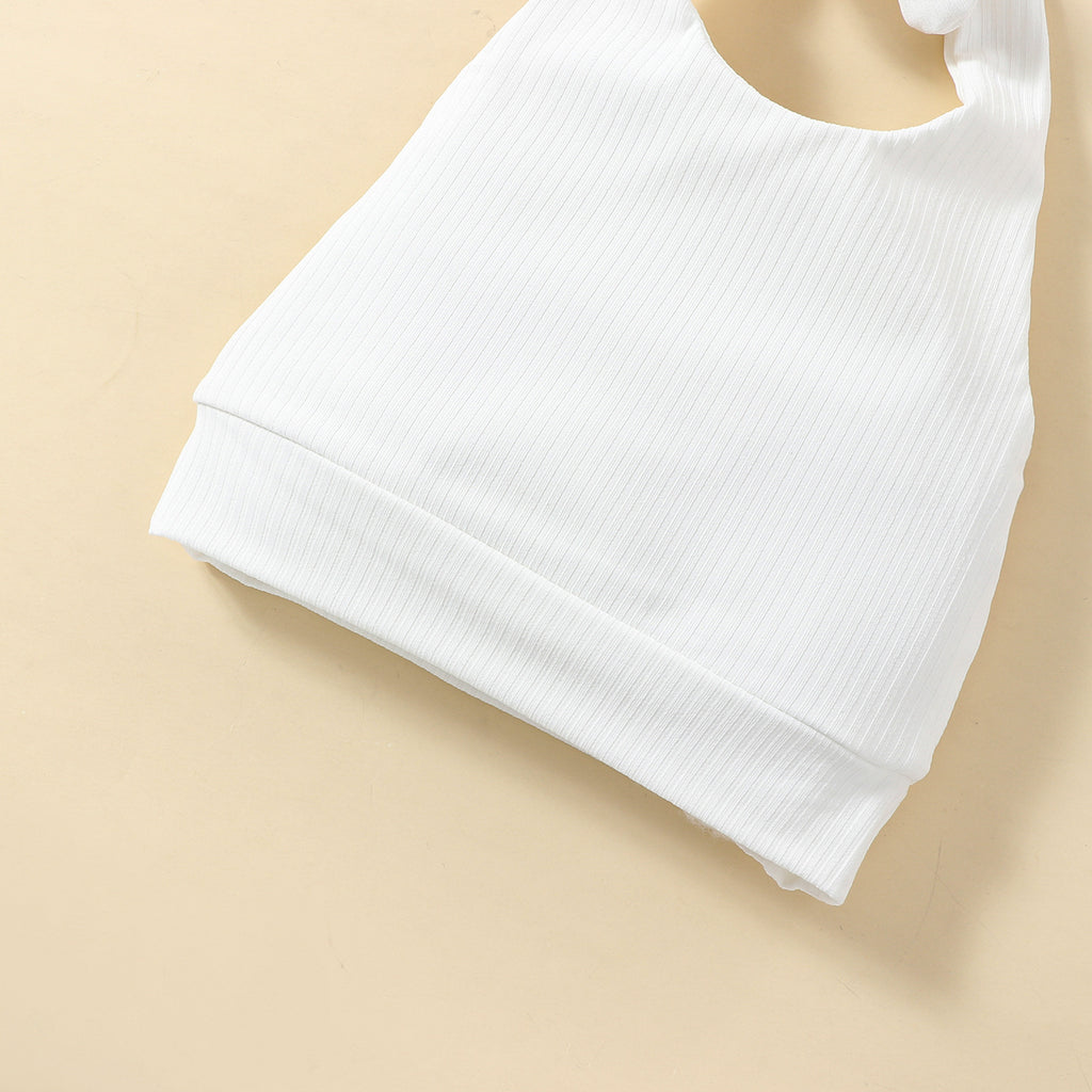 A set of children's clothing including a white sleeveless top with a bow at the neck, a pink skort with a floral pattern, and a matching hairband, displayed against a beige background with decorative elements like flowers and stars.