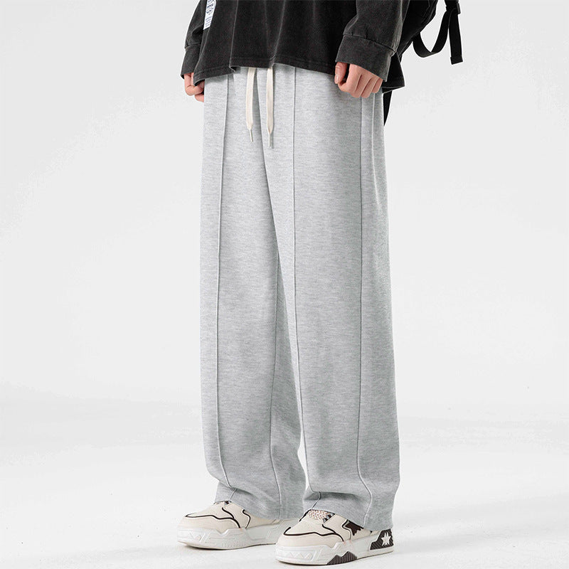 A pair of loose straight casual men's pants in black color, with a focus on the design and fit.