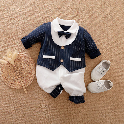 A set of baby autumn clothing featuring a wine red and white striped romper with long sleeves, a white shirt, and a bow tie. Accompanied by white baby shoes and a frame for a photo.