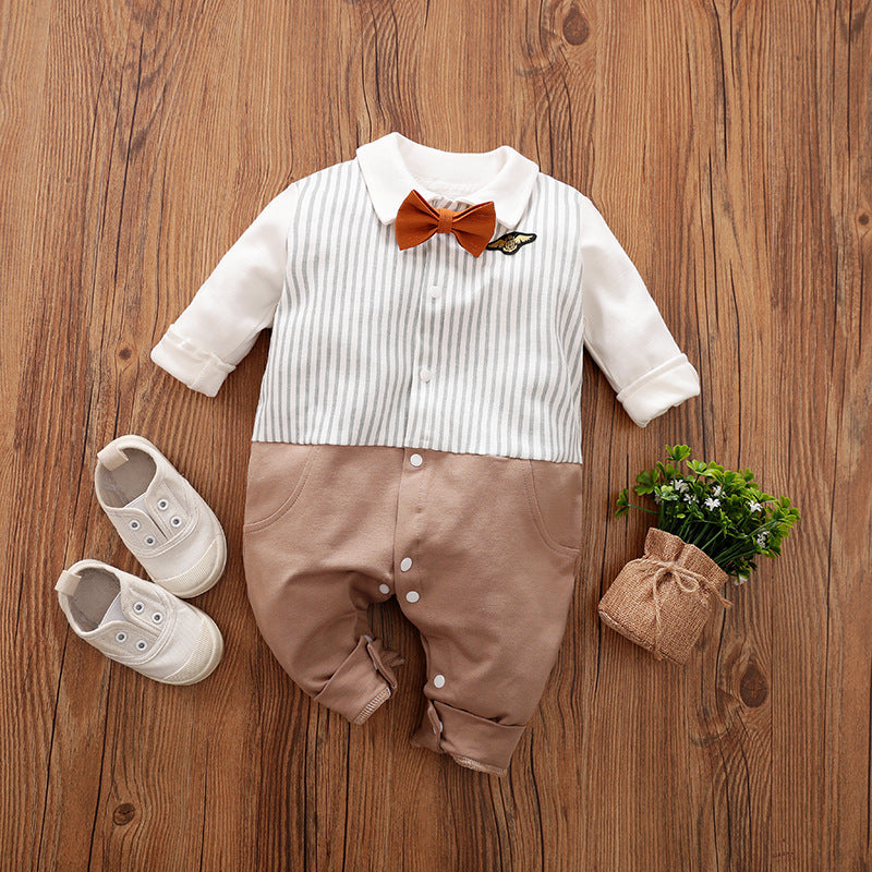 A set of baby autumn clothing featuring a wine red and white striped romper with long sleeves, a white shirt, and a bow tie. Accompanied by white baby shoes and a frame for a photo.