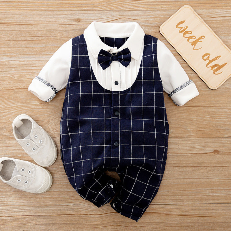 A set of baby autumn clothing featuring a wine red and white striped romper with long sleeves, a white shirt, and a bow tie. Accompanied by white baby shoes and a frame for a photo.