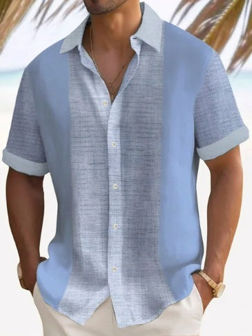 A man wearing a short-sleeved, striped beach shirt in white and blue colors