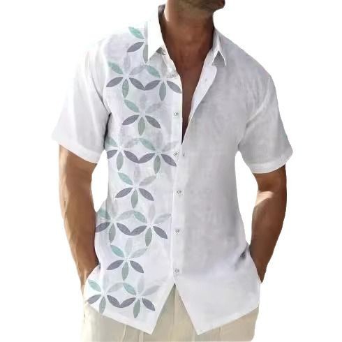 A man wearing a short-sleeved, striped beach shirt in white and blue colors