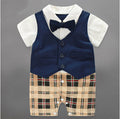 Baby onesie with long sleeves, featuring a vest and bow tie, with a plaid pattern on the lower part.