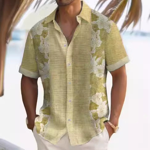 A man wearing a short-sleeved, striped beach shirt in white and blue colors