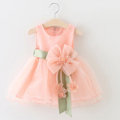 Peach baby girls' gauze dress with large pink bow and green sash, perfect sleeveless summer princess dress for toddlers.
