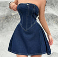 Stylish women's strapless denim dress with structured waist and flared skirt, perfect for Y2K-inspired summer clubwear.