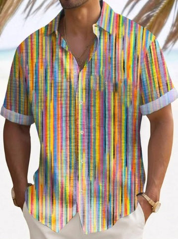 A man wearing a short-sleeved, striped beach shirt in white with multi colors