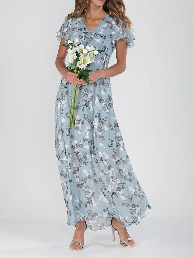 A model wearing a floral print, short sleeve, V-neck, A-line, maxi dress in blue, with additional color options shown on the side.