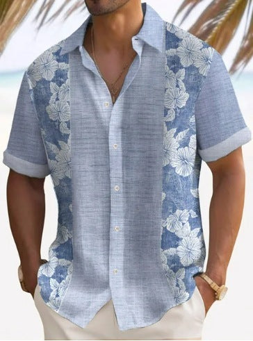 A man wearing a short-sleeved, striped beach shirt in white and blue colors