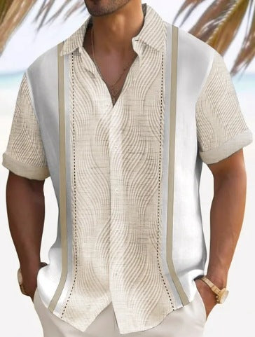 A man wearing a short-sleeved, striped beach shirt in white and cream colors