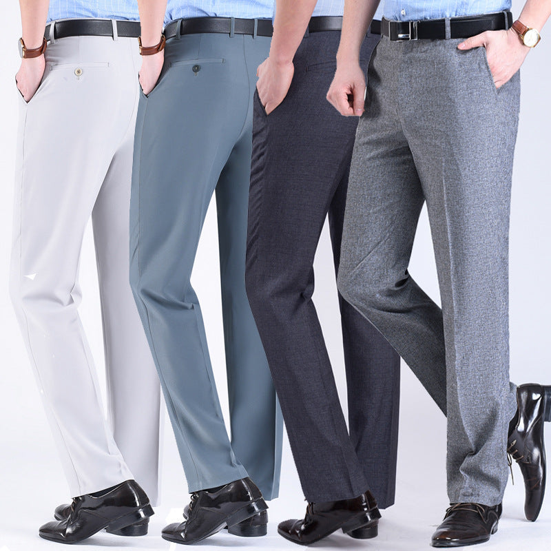 Three pairs of men's suit pants in white, blue, and gray colors, displayed side by side against a white background.