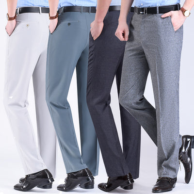 Three pairs of men's suit pants in white, blue, and gray colors, displayed side by side against a white background.