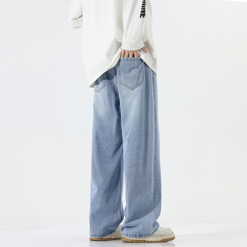 A pair of men's straight-leg jeans in a vintage blue and black gray color.