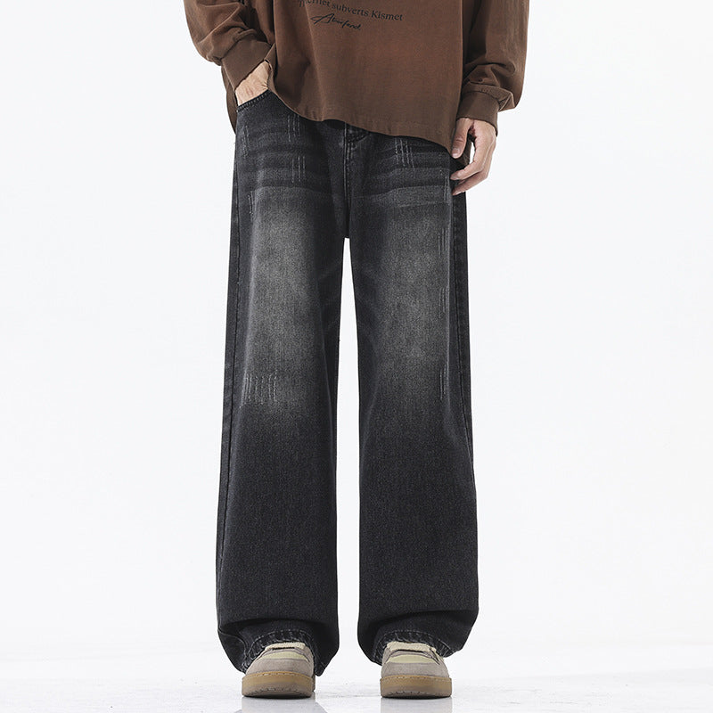 A pair of men's straight-leg jeans in a vintage blue and black gray color.