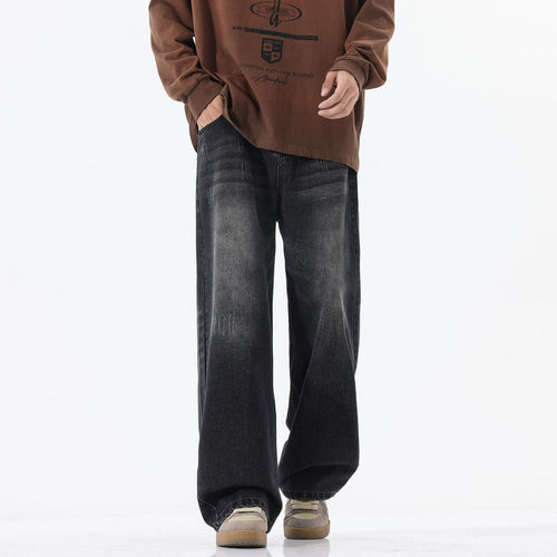 A pair of men's straight-leg jeans in a vintage blue and black gray color.