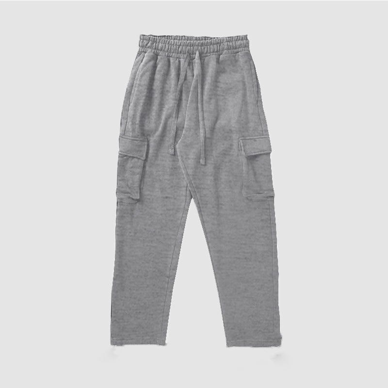 A pair of men's straight-leg trousers with multi-pocket design and drawstring waist in a black color.