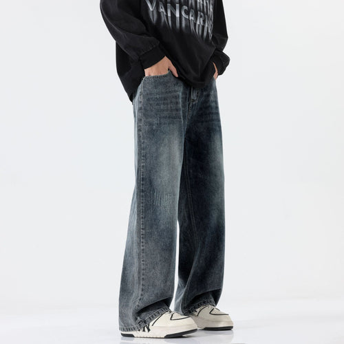 A pair of men's straight-leg jeans in a vintage blue and black gray color.