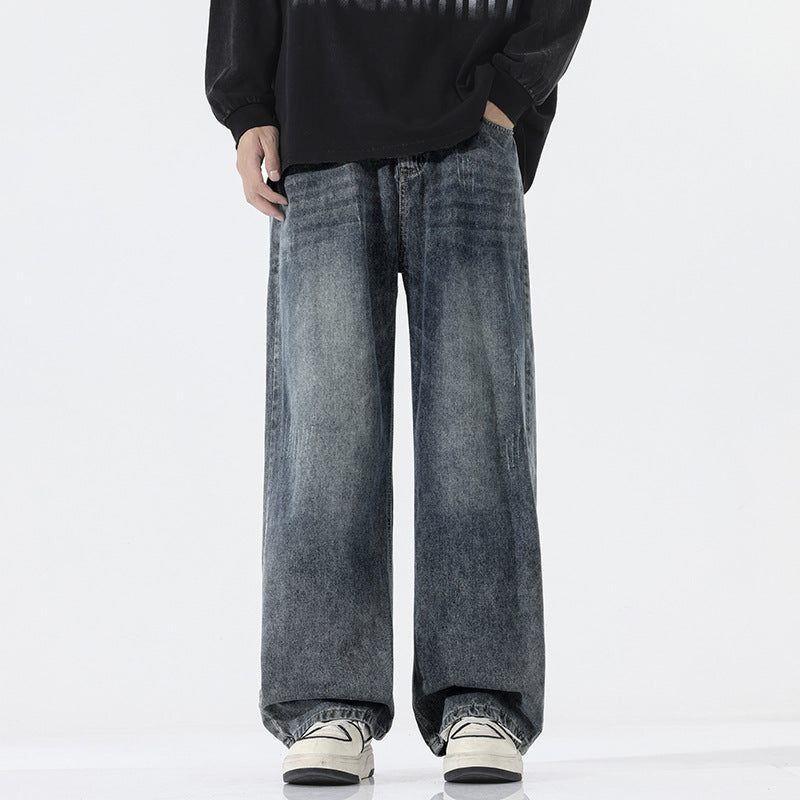 A pair of men's straight-leg jeans in a vintage blue and black gray color.