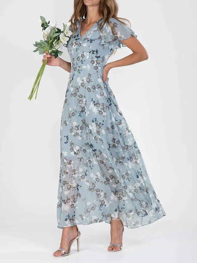 A model wearing a floral print, short sleeve, V-neck, A-line, maxi dress in blue, with additional color options shown on the side.