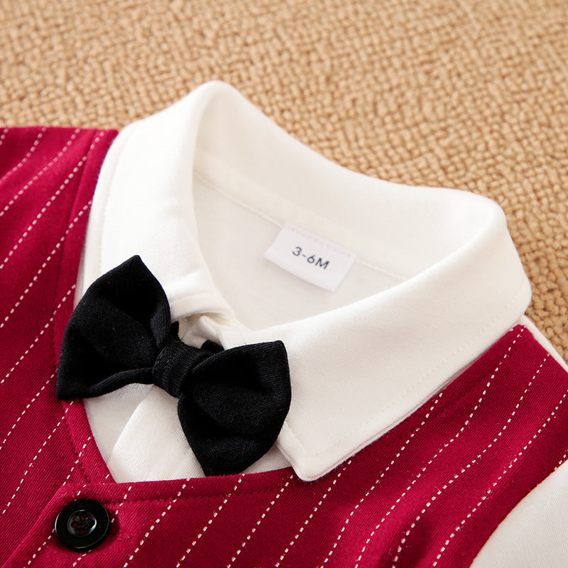 A set of baby autumn clothing featuring a wine red and white striped romper with long sleeves, a white shirt, and a bow tie. Accompanied by white baby shoes and a frame for a photo.
